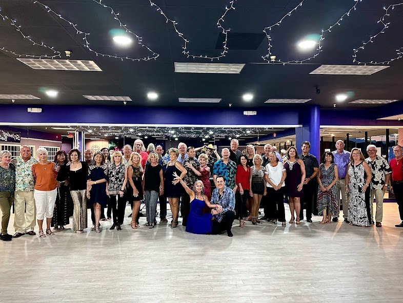 A group of dancers, smiling for camera